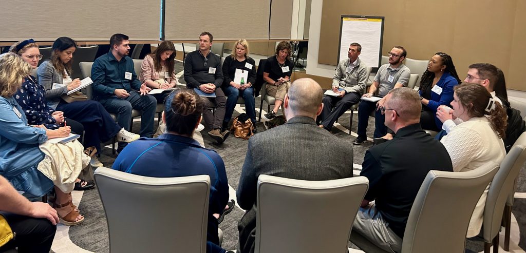 Members collaborating at Member Summit 2024 in Fort Worth, TX.